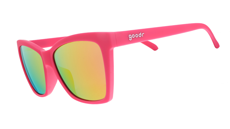 Three-quarter angle view of hot pink angled cat-eye sunglasses with pink reflective lenses.