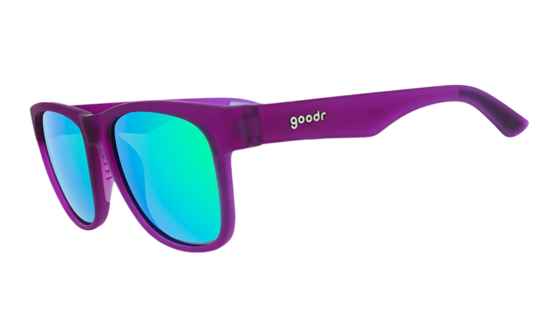 Three-quarter angle view of wide-fit purple sunglasses with square-shaped green reflective lenses.