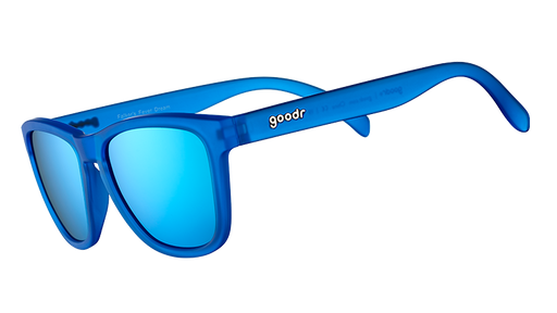 Three-quarter angle view of royal blue square-framed sunglasses with bright blue reflective lenses on a white background.