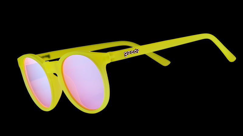 Three-quarter angle view of yellow round sunglasses with rose-tinted circle lenses.