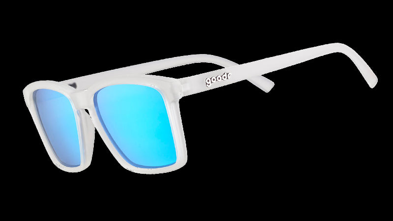 Three-quarter angle view of slim-fit clear sunglasses with square-shaped reflective blue lenses.