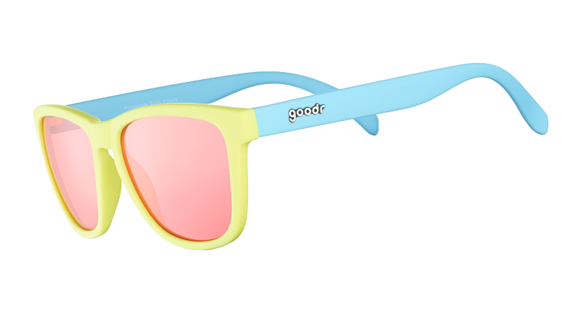 Three-quarter angle view of pastel blue and yellow sunglasses with square-shaped rose-tinted lenses.