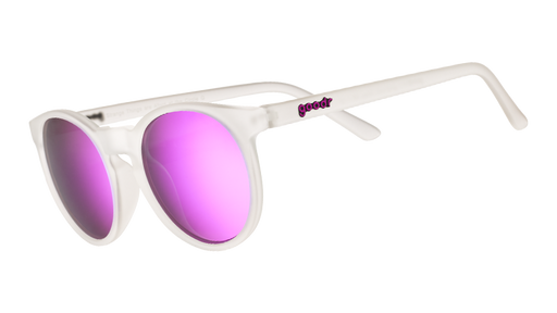 Three-quarter angle view of clear sunglasses with round reflective purple lenses.