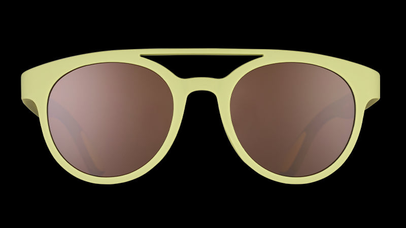 Front view of olive green round double bridge sunglasses with non-reflective brown lenses.