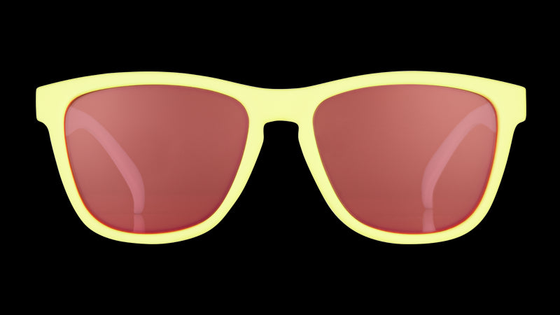 Front view of pastel yellow sunglasses with rose-tinted square lenses.