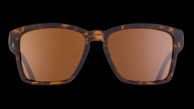 Front view of brown tortoiseshell sunglasses with brown non-reflective lenses.