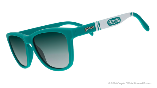 Three-quarter angle view of turquoise sunglasses w/ white Crayola marker pattern + green gradient lenses tilted down.