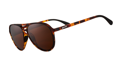 Three-quarter angle view of brown tortoiseshell aviator sunglasses with brown non-reflective lenses on a white background.