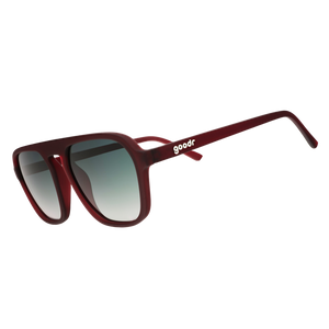 Three-quarter angle view of rust-brown Retro G sunglasses with green gradient lenses on a white background.