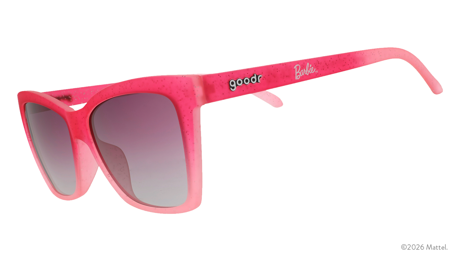 Three-quarter angle view of translucent, angular, glittery pink ombre cat-eye sunglasses with purple gradient lenses.
