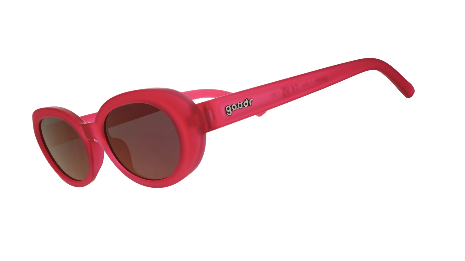 Three-quarter angle view of hot pink oval sunglasses with dark red polarized lenses against a white background.