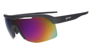 Three-quarter angle view of black shield sunnies with purple reflective wrap lenses tilted down on a white background.