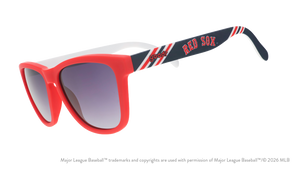 Three-quarter angle view of a pair of red, white, and navy sunnies featuring the Red Sox's team name logo on the arm.