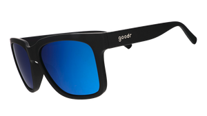 Three-quarter angle view of black sunglasses with blue lenses designed to float in water.