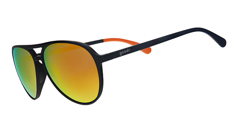 Three-quarter angle view of black aviator sunglasses with amber lenses.