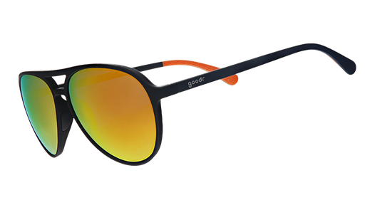 Three-quarter angle view of black aviator sunglasses with amber lenses.
