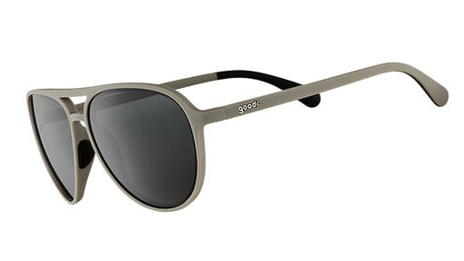 Three-quarter angle view of matte gray aviator sunglasses with non-reflective black lenses on a white background.