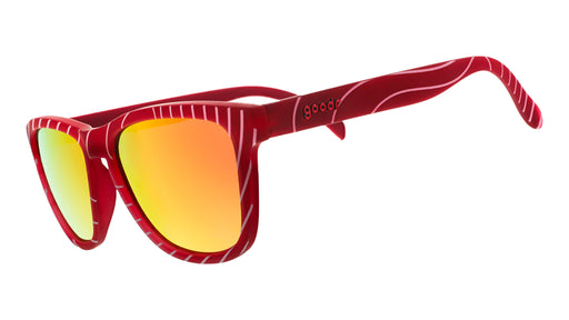 Three-quarter angle view of limited-edition tuna-patterned sunglasses with burnt orange polarized lenses.