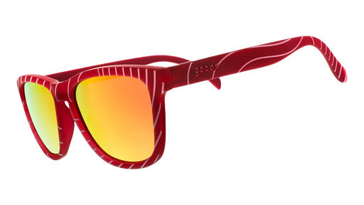 Three-quarter angle view of limited-edition tuna-patterned sunglasses with burnt orange polarized lenses.