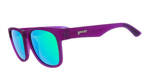 Three-quarter angle view of wide-fit purple sunglasses with square-shaped green reflective lenses.