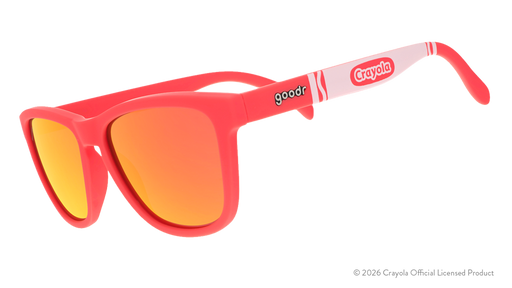 Three-quarter angle view of coral sunglasses w/ white Crayola marker pattern+burnt orange reflective lenses tilted down.