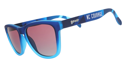 Three-quarter angle view of Atlantic blue frames with rose gradient lenses and NC Courage logo.