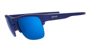 Three-quarter angle view of navy blue sunnies with half-rim frames+blue gradient lenses on a white background.