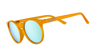 Three-quarter angle view of round orange sunglasses with light blue reflective polarized lenses.