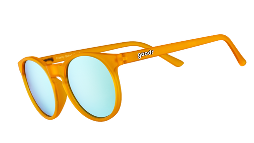 Three-quarter angle view of round orange sunglasses with light blue reflective polarized lenses.