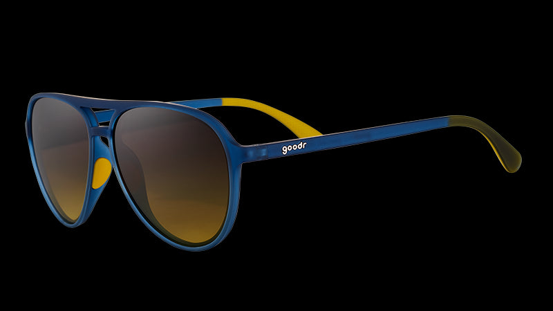 Three-quarter angle view of navy blue aviator sunglasses with dark amber gradient lenses.