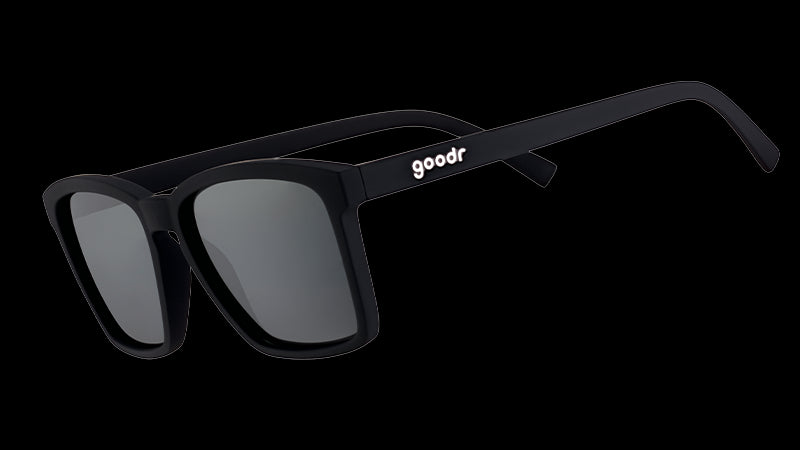 Three-quarter angle view of square-shaped black sunglasses with non-reflective lenses.