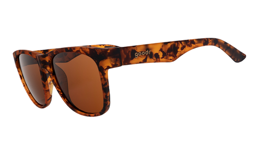 Three-quarter angle view of square-shaped, wide-fit tortoiseshell sunglasses with brown non-reflective lenses.