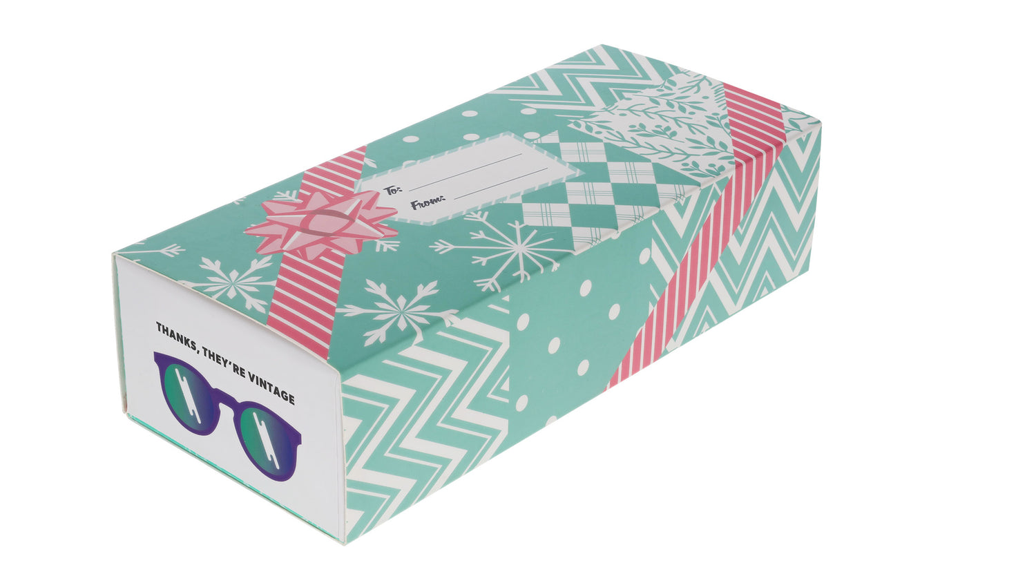 Three-quarter angle view of a goodr box slipped into a teal holiday wrapping sleeve with a festive pink-and-white design.