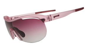Three-quarter angle view of translucent purple wrap shield sunglasses with gradient purple lenses against a white background.