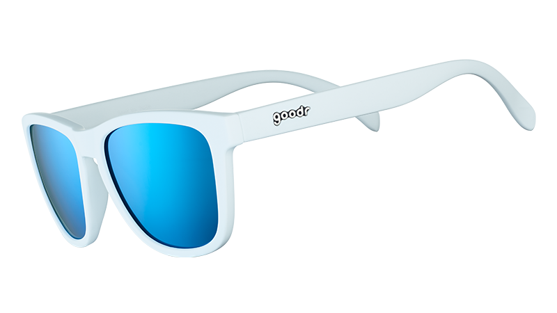 Three-quarter angle view of square-framed white sunglasses with blue reflective polarized lenses.