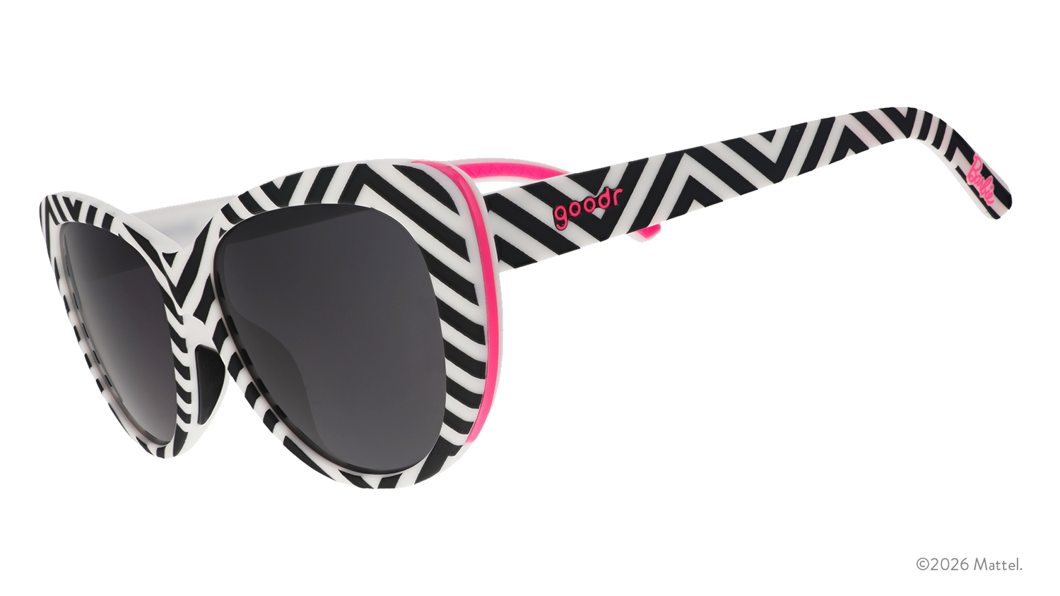 Three-quarter angle view of black and white chevron-striped cat-eye sunnies with black gradient lenses and hot pink accents.