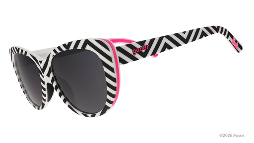 Three-quarter angle view of black and white chevron-striped cat-eye sunnies with black gradient lenses and hot pink accents.