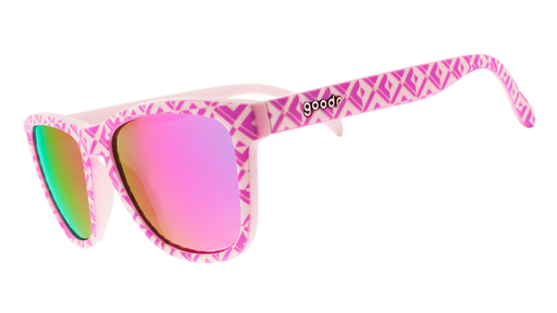 Three-quarter angle view of a pair of textured pink tile sunglasses with purple-pink reflective lenses.