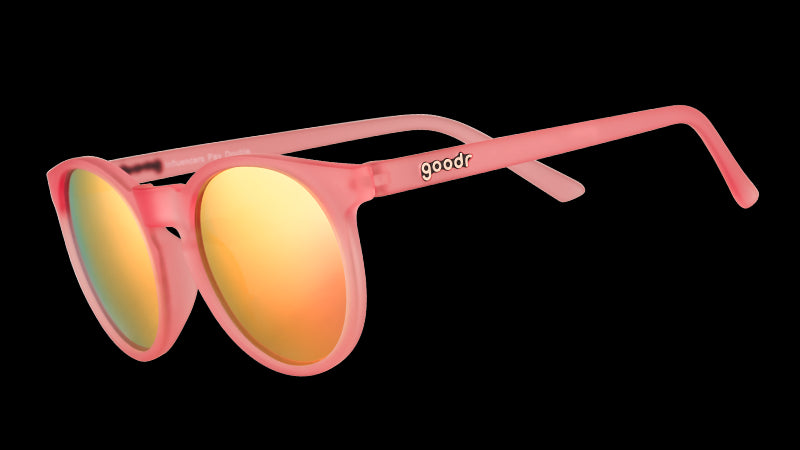 Three-quarter angle view of pink round sunglasses with pink mirrored polarized lenses.
