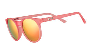 Three-quarter angle view of pink round sunglasses with pink mirrored polarized lenses.