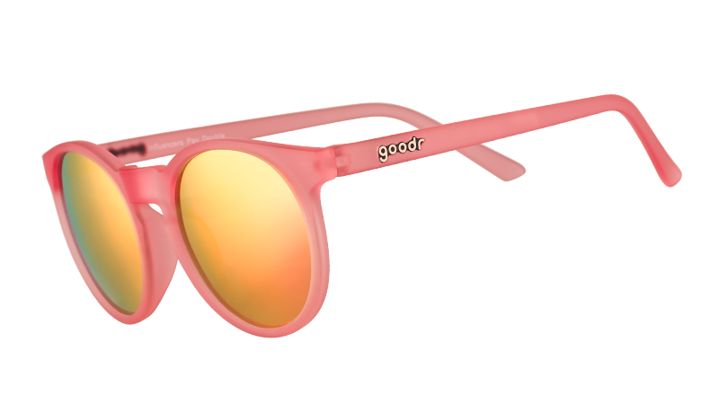 Three-quarter angle view of pink round sunglasses with pink mirrored polarized lenses.
