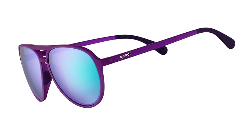Three-quarter angle view of purple aviator sunglasses with green reflective lenses.