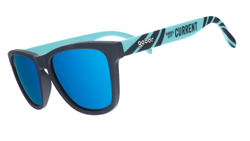 Three-quarter view of teal and storm blue sunglasses with a river current pattern, teal lenses, and the Kansas City Current logo.