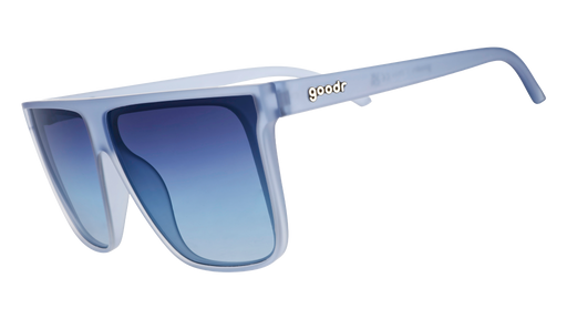 Three-quarter angle view of oversized, dusty blue Fly G sunglasses with blue gradient lenses.