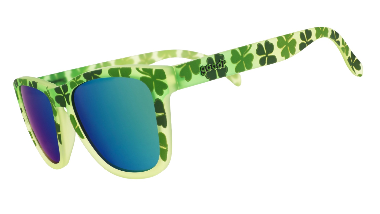 Three-quarter angle view of green shamrock print sunglasses w/ green+gold reflective lenses tilted down.
