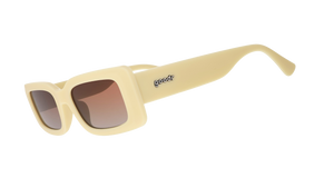 Three-quarter angle view of yellow rectangular sunglasses with brown-tinted polarized lenses against a white background.