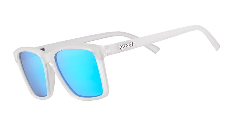 Three-quarter angle view of slim-fit clear sunglasses with square-shaped reflective blue lenses.