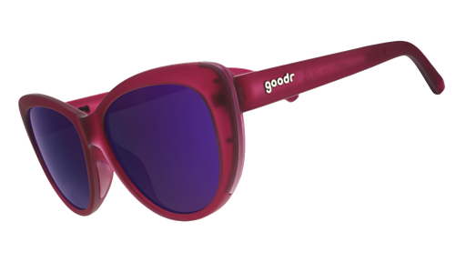 Three-quarter angle view of translucent purple cat-eye sunglasses with purple reflective lenses.