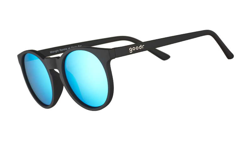 Three-quarter angle view of retro-inspired black round sunglasses with circle-shaped mirrored blue lenses.