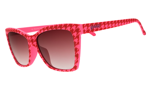 Three-quarter angle view of pink and red houndstooth Pop Gs with rose gradient lenses.